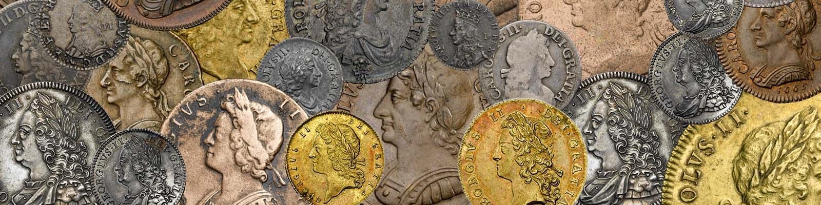 A close up picture of a variety of copper, silver and gold coins from the reigns of different British Monarchs beginning with Charles II