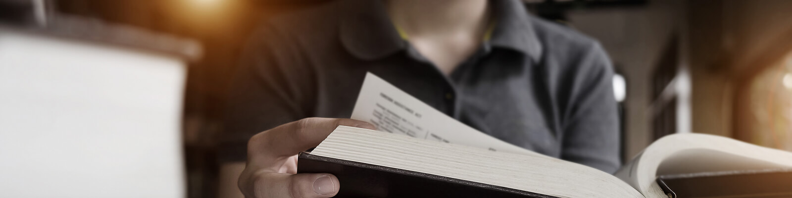 A picture of a man reading a book