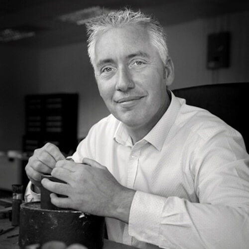 A black and white image of Gordon Summers, Chief Engraver at the Royal Mint